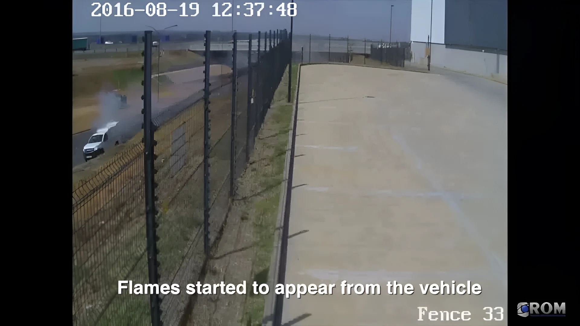 Real CCTV frame of smoke and flame from a vehicle, picked up by an outdoor camera running Woodcock AI